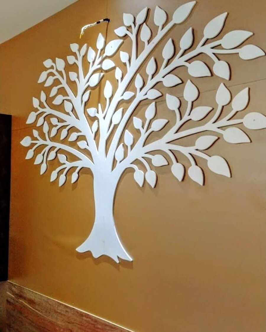 White tree-of-life wall carving installed by Khushi Crafts